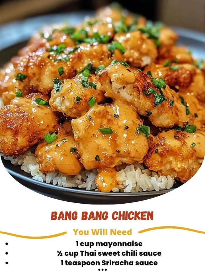 Plate of Bang Bang Chicken drizzled with spicy sauce and garnished with green onions.