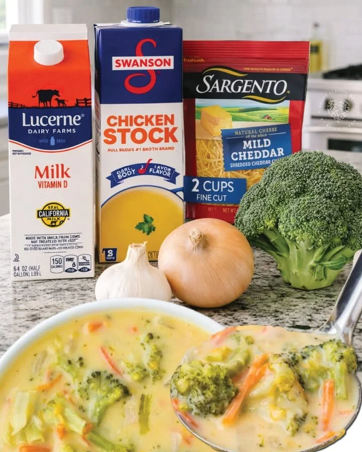 Delicious bowl of broccoli cheddar soup with fresh broccoli and cheese
