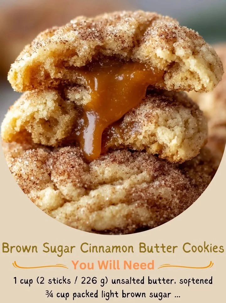 Brown sugar cinnamon cookies with caramel centers on a baking tray.