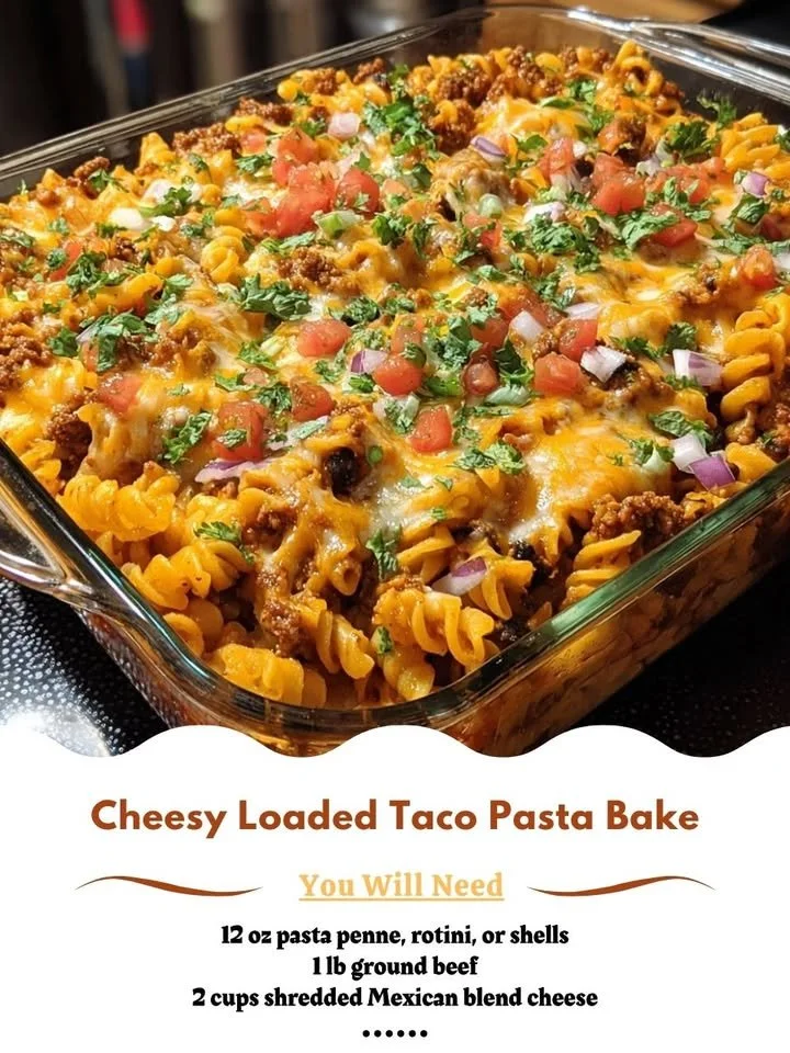 Baked cheesy taco pasta casserole with vibrant toppings and a golden crust