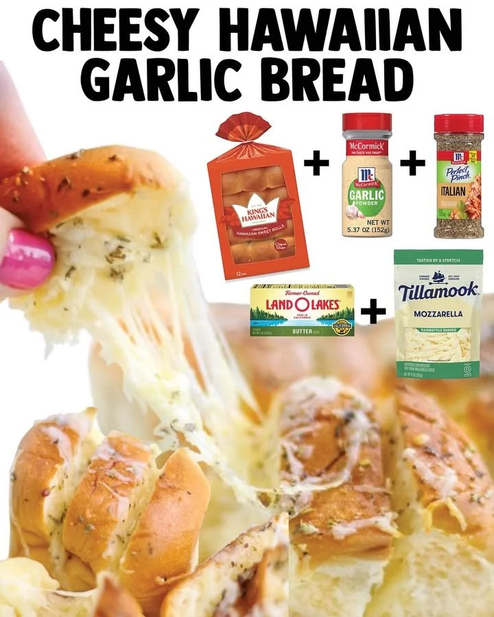 Cheesy pull-apart garlic bread topped with melted cheese and herbs