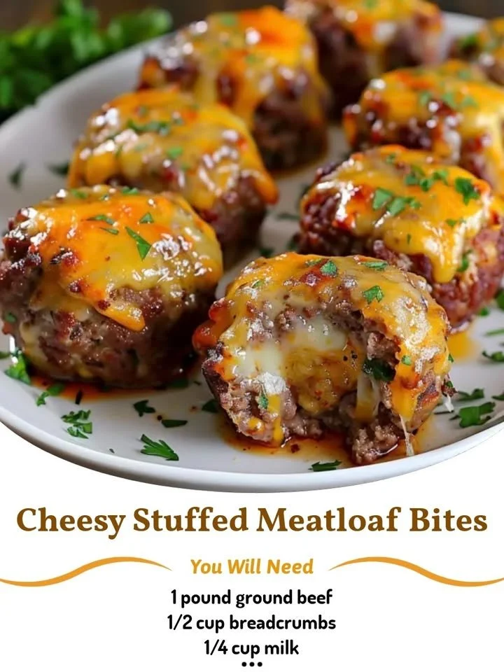 Cheesy stuffed meatloaf bites served on a platter with dipping sauce