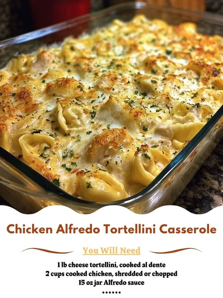 Creamy Chicken Alfredo Tortellini Casserole topped with cheese and herbs.