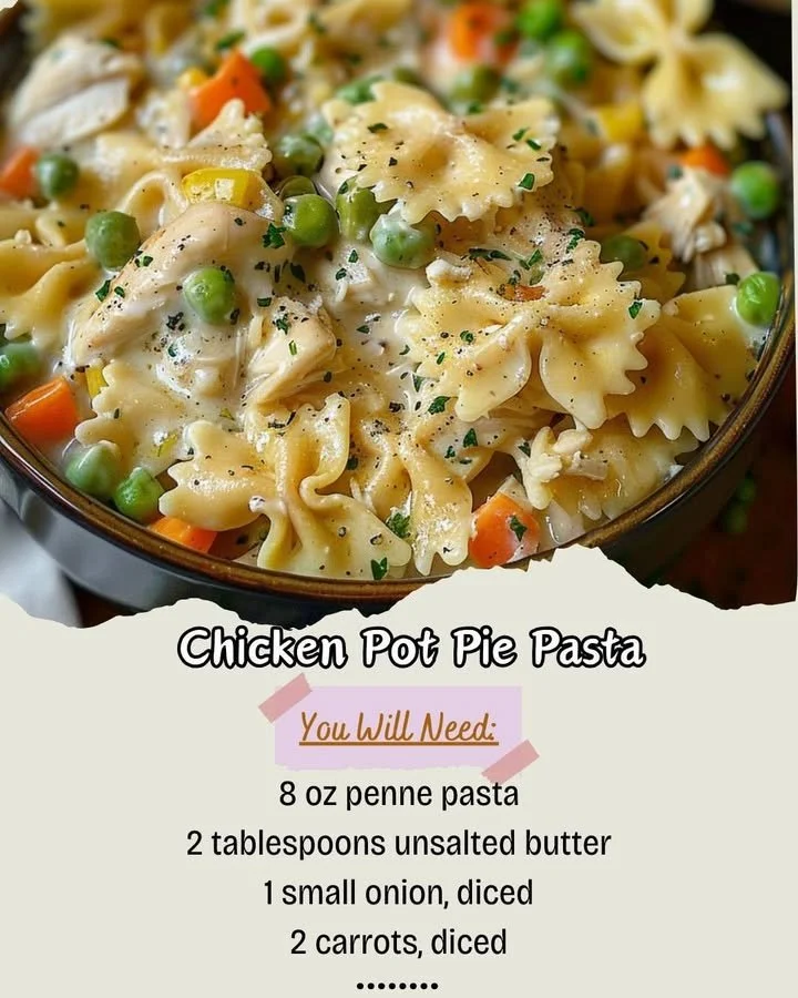 Creamy Chicken Pot Pie Pasta served in a white bowl with vegetables and herbs.