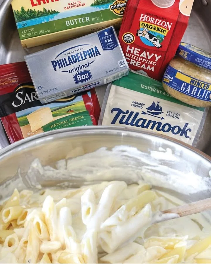 Creamy Alfredo sauce served with pasta in a white bowl