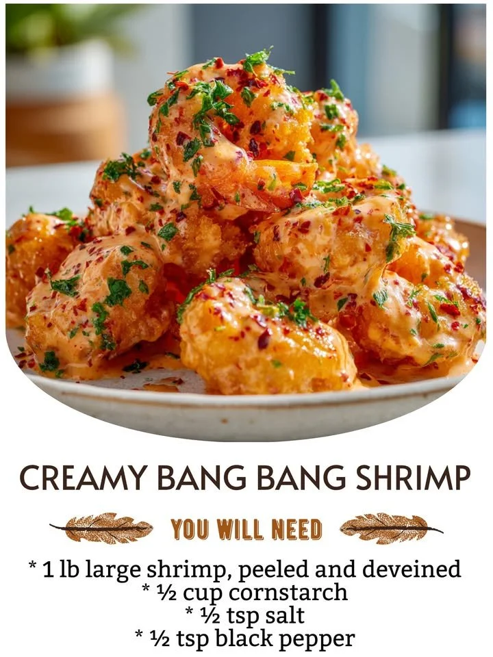 Plate of creamy Bang Bang Shrimp with a spicy sauce and garnishes