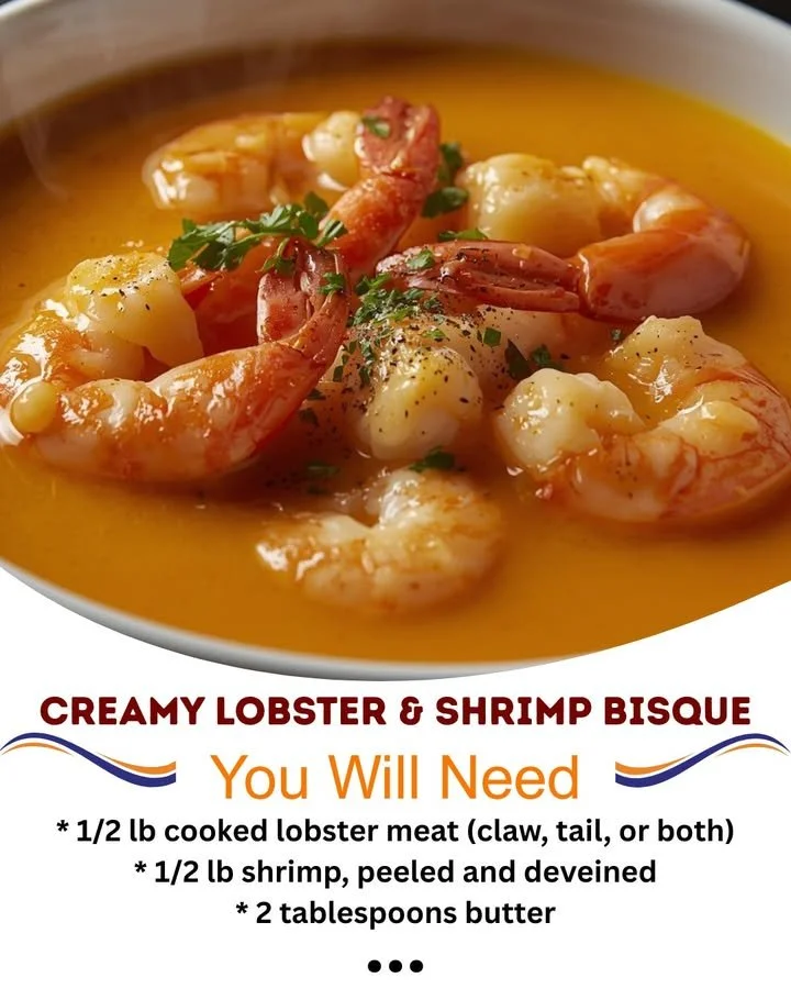 Bowl of creamy lobster bisque with shrimp garnished with herbs