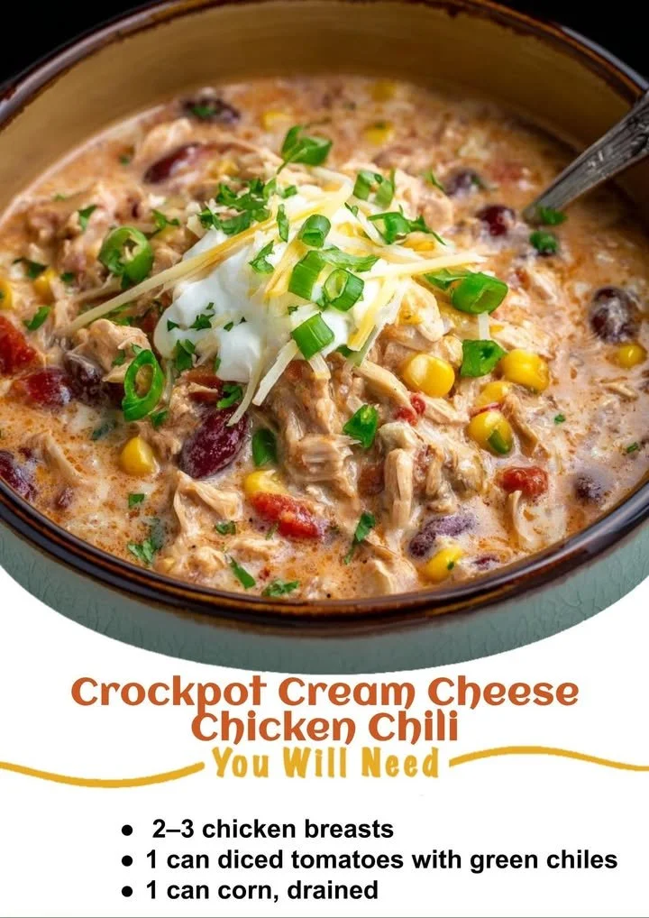 A bowl of creamy chicken chili with cream cheese, garnished and ready to serve.