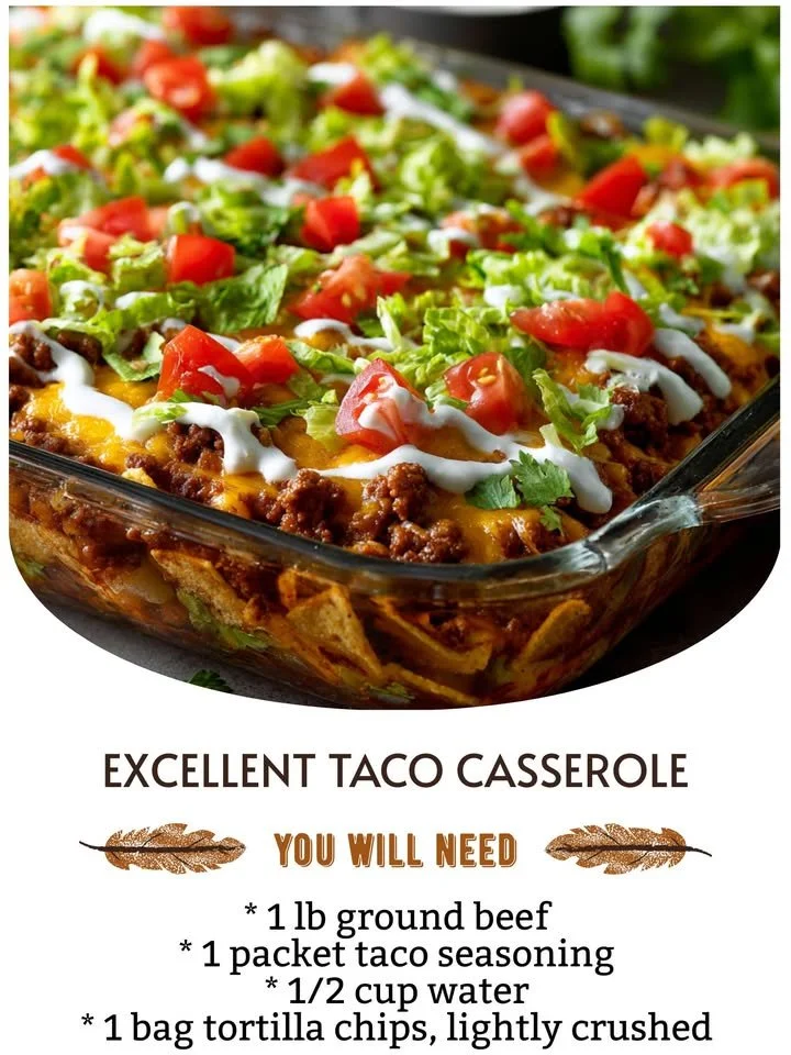Delicious taco casserole topped with cheese and garnished with fresh herbs