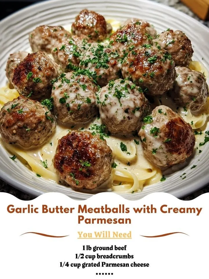 Plate of garlic butter meatballs topped with creamy parmesan cheese