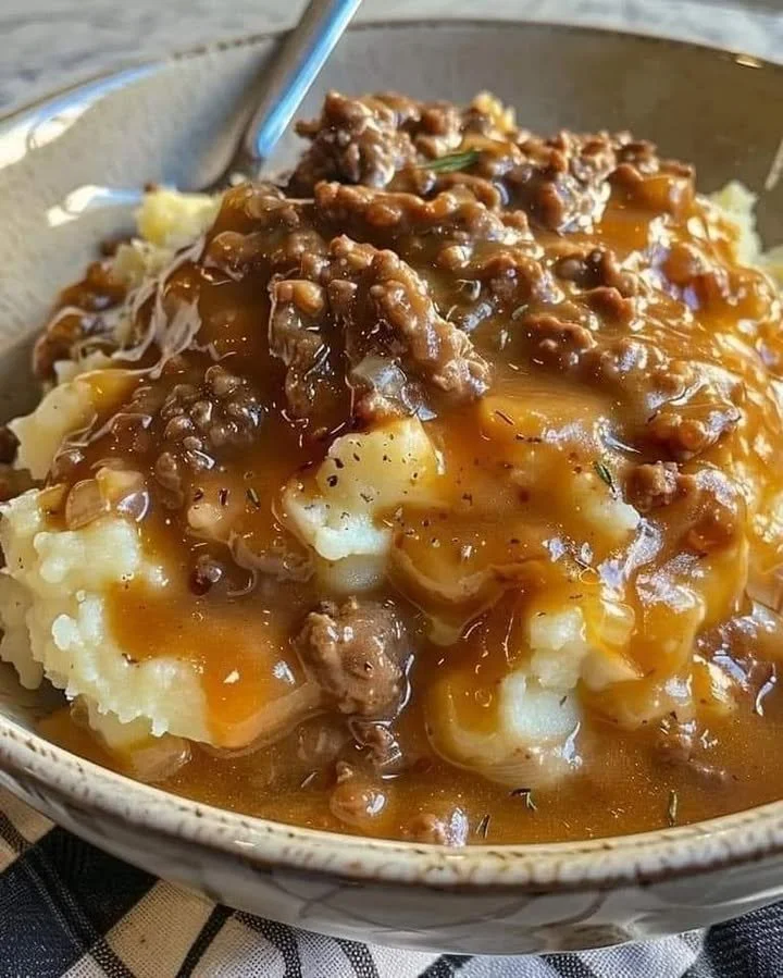 Ground beef and gravy served over fluffy mashed potatoes