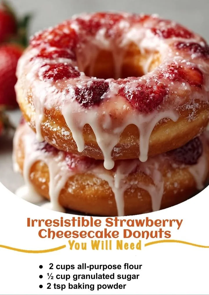 Delicious strawberry cheesecake donuts topped with fresh strawberries and cheesecake glaze