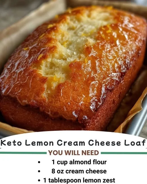 Keto Lemon Cream Cheese Loaf garnished with lemon slices on a wooden table