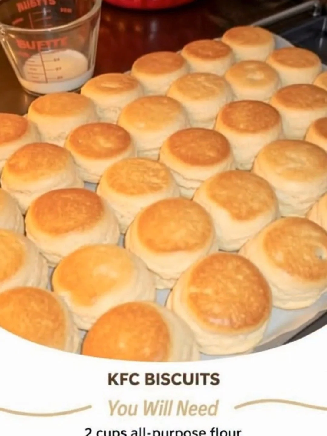 Homemade KFC-style biscuits served with butter and honey.