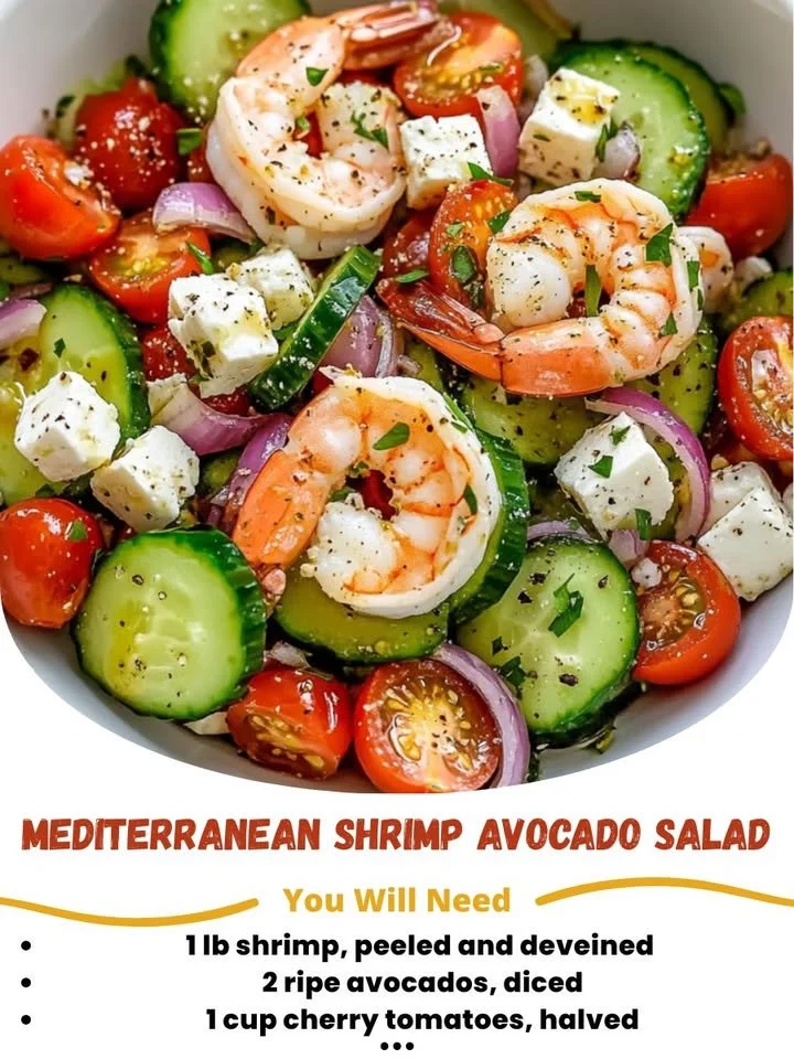 Mediterranean shrimp avocado salad topped with fresh vegetables and herbs.
