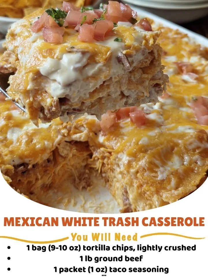 Mexican White Trash Casserole with cheese and toppings in a baking dish