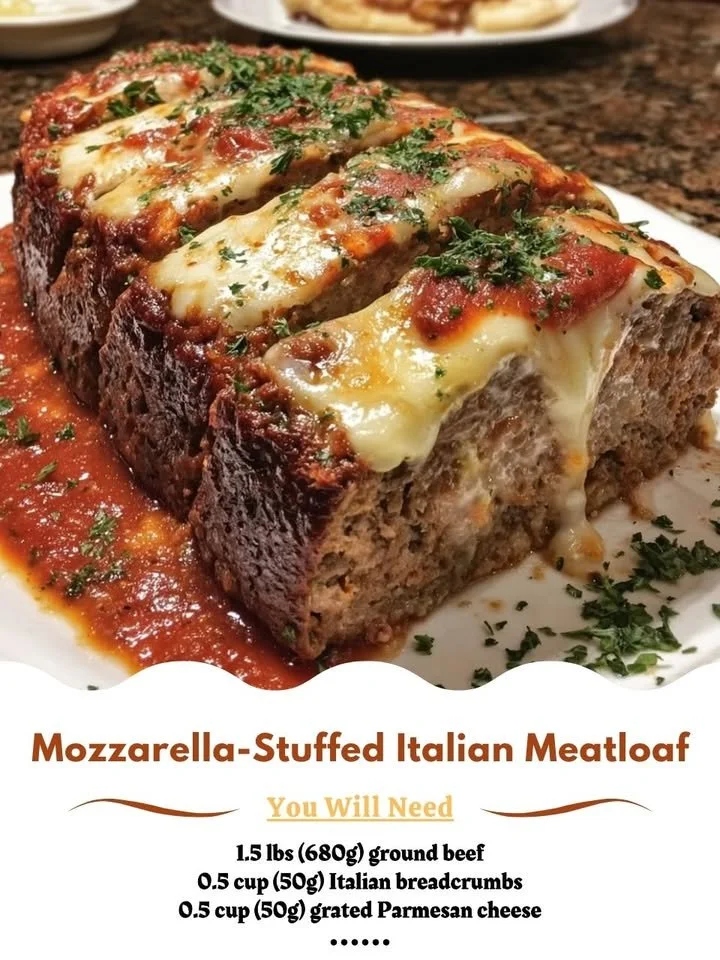 Mozzarella-stuffed Italian meatloaf sliced on a wooden board