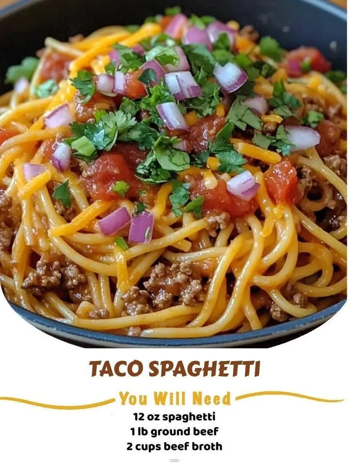 A colorful serving of Taco Spaghetti topped with cheese and cilantro