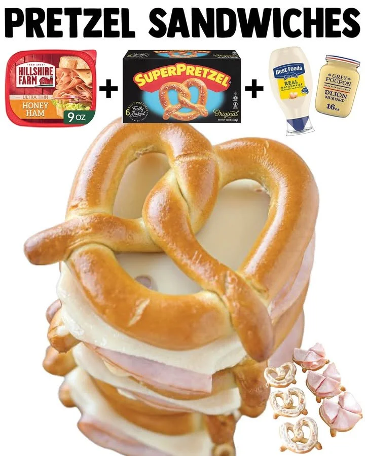Delicious warm pretzel sandwiches with various fillings served on a rustic plate