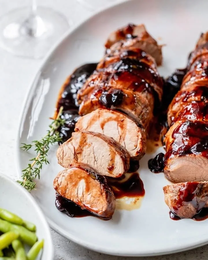 Cherry Balsamic Pork Tenderloin with vibrant sauce and herbs