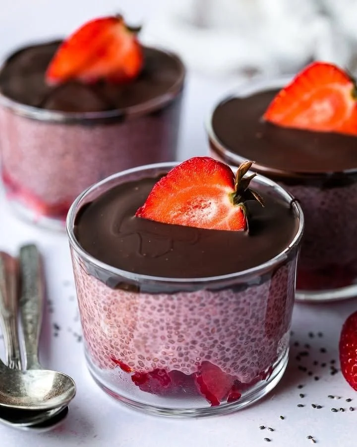 Chocolate-Covered Strawberry Chia Pudding in a glass topped with fresh strawberries