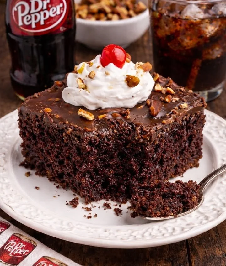 Delicious slice of Dr. Pepper Chocolate Cake topped with chocolate frosting