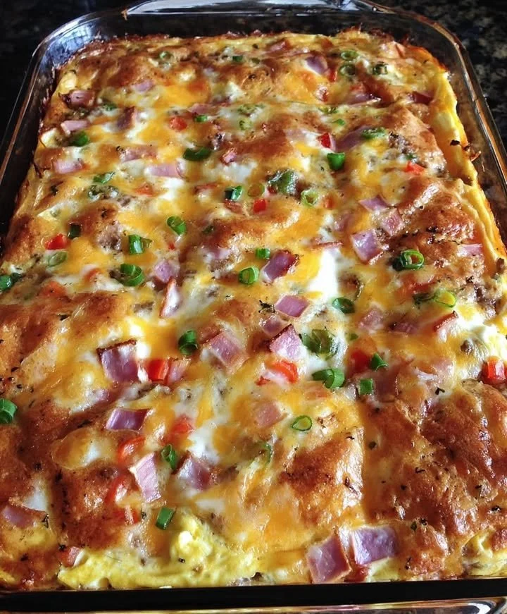 Hearty breakfast casserole with eggs, cheese, and vegetables baked to perfection.