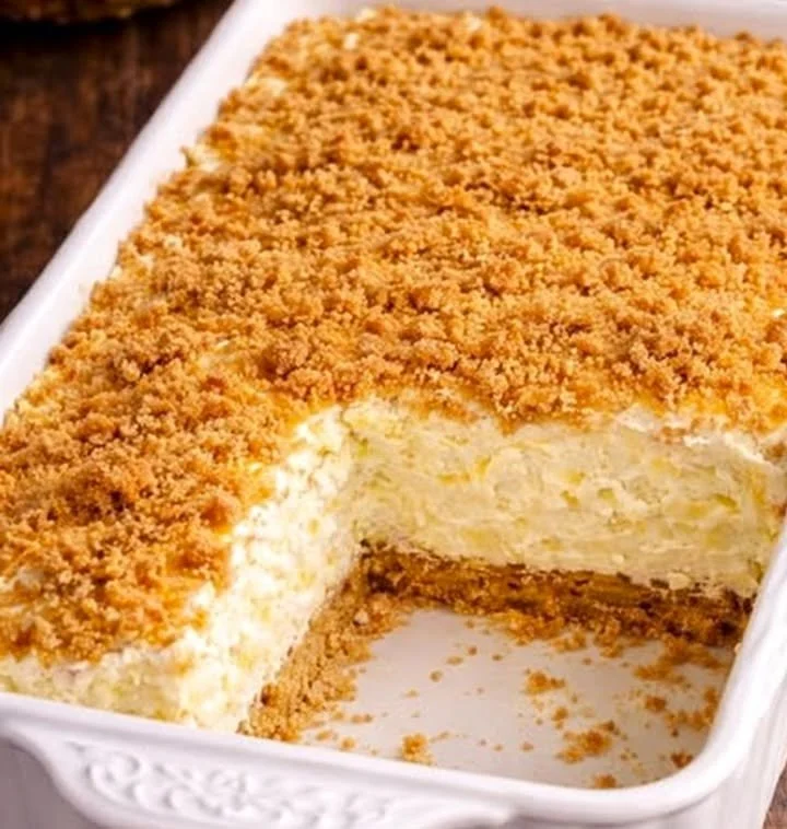 Incredible Pineapple Dream Dessert topped with fresh pineapple and cream