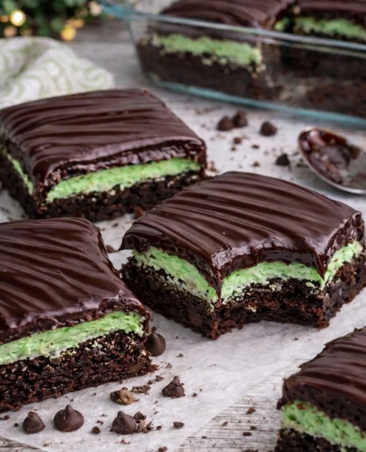 Delicious Mint Chocolate Brownies topped with mint frosting and chocolate drizzle