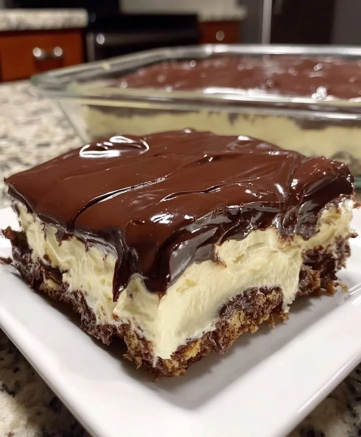 No-bake chocolate eclair cake with creamy filling and chocolate ganache topping