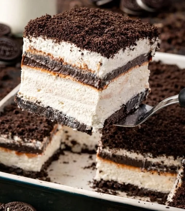 Delicious No Bake Oreo Delight dessert served on a plate with crushed Oreos