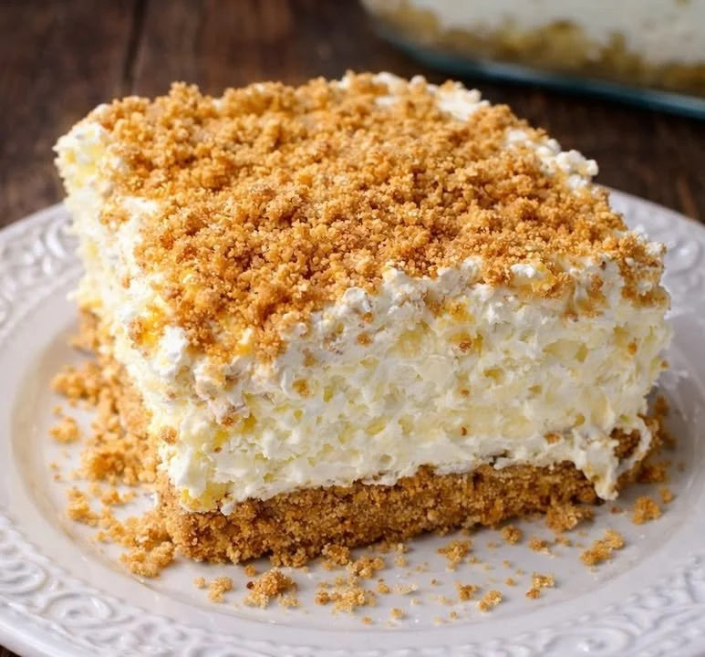 No Bake Pineapple Dream Dessert with cream and pineapple topping