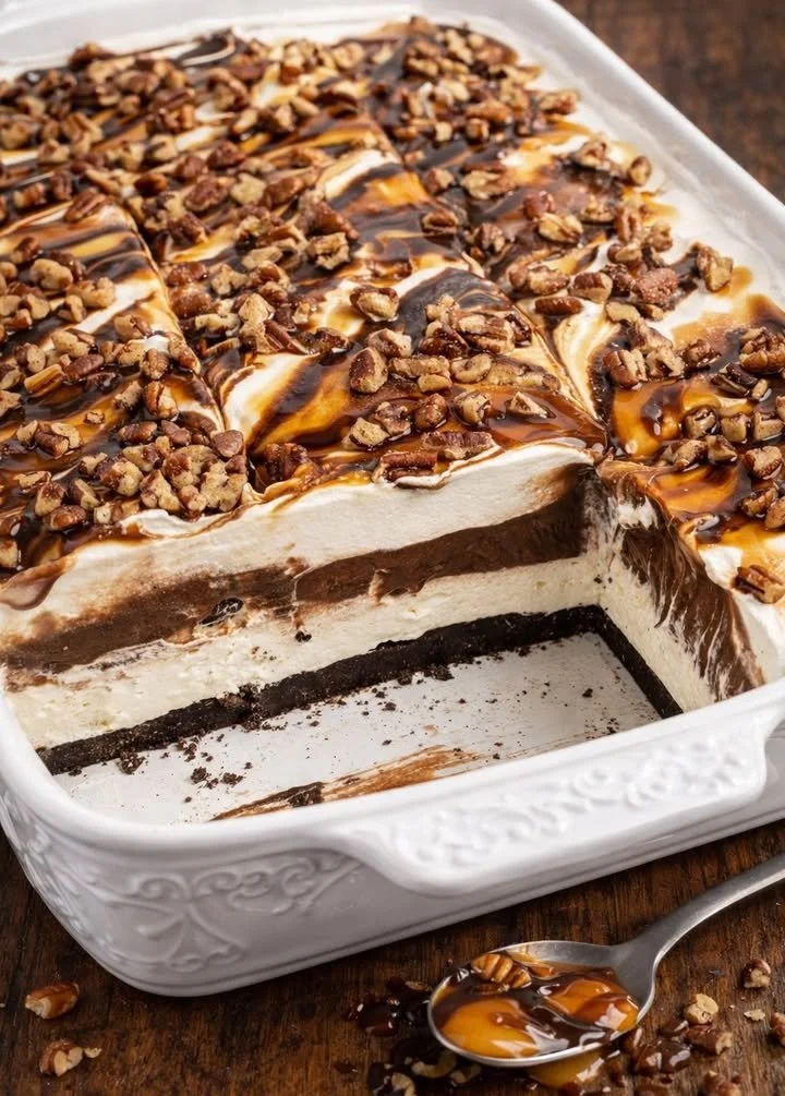 No Bake Turtle Lush dessert topped with chocolate and caramel sauce.