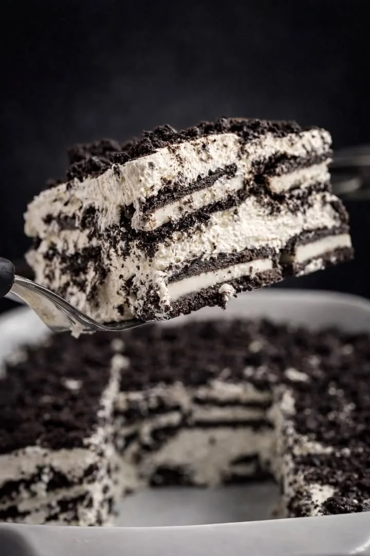 Delicious Oreo Icebox Cake with layers of cream and crushed Oreos, ready to serve.