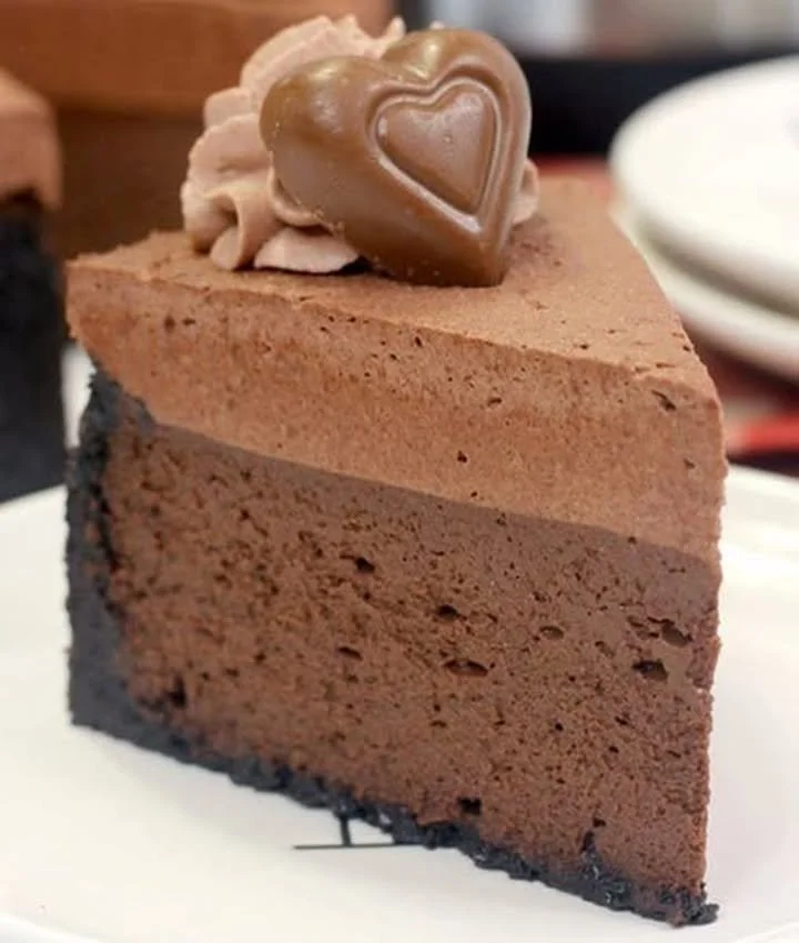 Triple Chocolate Godiva Cheesecake topped with chocolate shavings