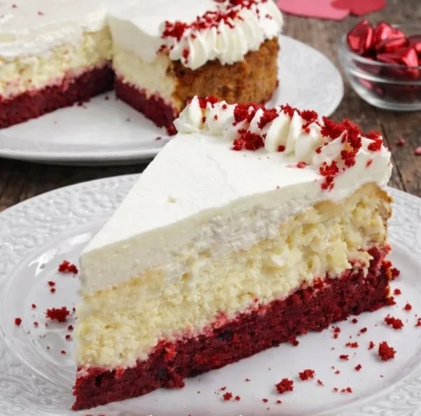 Valentine's Day Red Velvet Cheesecake topped with cream cheese frosting