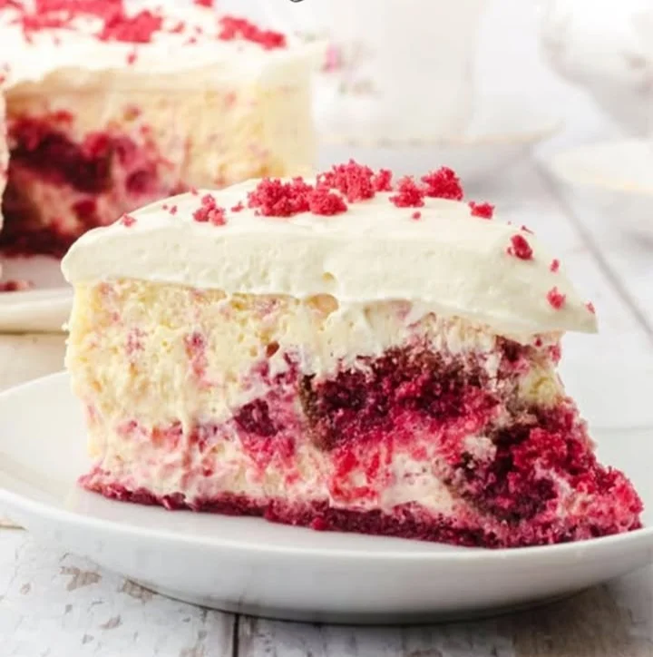 Valentine's Day red velvet cheesecake topped with cream cheese frosting