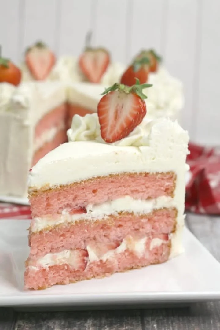 Valentine's Day Strawberry Moscato Cake topped with fresh strawberries and Moscato wine glaze.