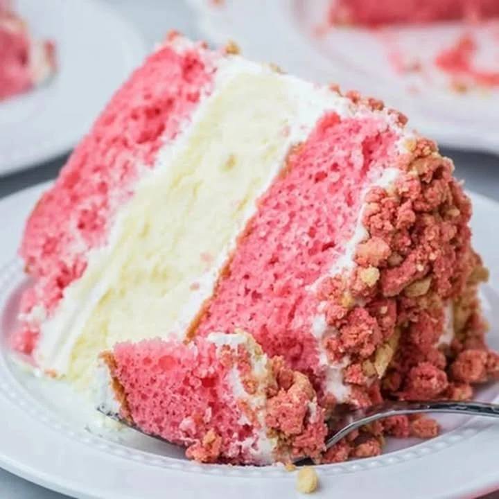 Valentine's Day strawberry shortcake cheesecake cake topped with fresh strawberries